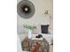 Cozy living room showcasing stylish decor, including a round rattan coffee table, plush cushions, and a modern lamp at 42 Poinsett St, Charleston, SC 29403