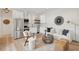 Bright living space with stainless steel appliances, white cabinets, hardwood floors, and stylish decor at 42 Poinsett St, Charleston, SC 29403