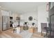 Inviting living space with stainless steel appliances, white cabinets, hardwood floors, and stylish decor at 42 Poinsett St, Charleston, SC 29403