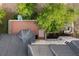 An aerial view showcases the expansive deck and patio with outdoor seating surrounded by lush greenery at 4213 Club Course Dr, North Charleston, SC 29420