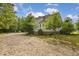The spacious backyard offers a deck, play equipment, and ample room for outdoor activities at 4213 Club Course Dr, North Charleston, SC 29420