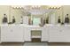 Bright bathroom with double vanity, large mirrors, and neutral tones offering a clean aesthetic at 4213 Club Course Dr, North Charleston, SC 29420