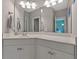 Bright bathroom boasts a large mirror, vanity with white cabinets, and stylish lighting at 4213 Club Course Dr, North Charleston, SC 29420