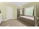 Bathroom featuring a glass enclosed shower, a soaking tub beneath a window, and neutral tiling at 4213 Club Course Dr, North Charleston, SC 29420