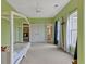 Large bedroom with a four-poster bed, ceiling fan, and multiple closets and doors at 4213 Club Course Dr, North Charleston, SC 29420