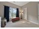 Bedroom with carpet floors, a window, and a vintage wooden chest at 4213 Club Course Dr, North Charleston, SC 29420