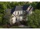 Charming two-story home with a landscaped yard and a welcoming entrance with green surroundings at 4213 Club Course Dr, North Charleston, SC 29420