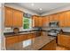 Bright kitchen featuring wooden cabinets, granite countertops, stainless steel appliances, and a kitchen island at 4213 Club Course Dr, North Charleston, SC 29420