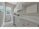 Laundry room features a washer, dryer, window, countertop, cabinets and drawers at 4213 Club Course Dr, North Charleston, SC 29420