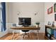 Well-lit office showcasing a wooden desk, hardwood floors, and stylish wall sconces at 4213 Club Course Dr, North Charleston, SC 29420
