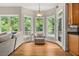 Sun-drenched sunroom with hardwood floors, large windows, and a comfortable armchair at 4213 Club Course Dr, North Charleston, SC 29420