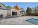 Back exterior of home, showcasing a patio, backyard pool, and unique roofline at 422 Palm St, Mount Pleasant, SC 29464