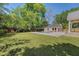 Spacious backyard with a pool and manicured lawn, perfect for outdoor activities and gatherings at 422 Palm St, Mount Pleasant, SC 29464