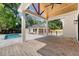 Spacious backyard with brick patio, outdoor structure, a pool, and garage at 422 Palm St, Mount Pleasant, SC 29464