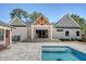 Back exterior of home, showcasing a patio, backyard pool, and unique roofline at 422 Palm St, Mount Pleasant, SC 29464