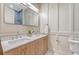 Modern bathroom with double vanity, stylish mirrors, and beautiful wainscoting at 422 Palm St, Mount Pleasant, SC 29464