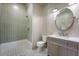 Well-lit bathroom with updated fixtures including a walk-in shower and patterned tile flooring at 422 Palm St, Mount Pleasant, SC 29464