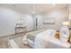 Bright bedroom featuring a large bed, neutral colors, and a decorative mirror on a console table at 422 Palm St, Mount Pleasant, SC 29464