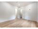Bright bedroom with hardwood floors, neutral walls, and double doors, leading to an adjacent room at 422 Palm St, Mount Pleasant, SC 29464