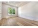 Bright bedroom featuring light wood floors, a window with a leafy view, and neutral wall color at 422 Palm St, Mount Pleasant, SC 29464