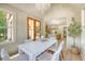 Inviting dining area featuring shiplap walls, wood floors, and an open view to the kitchen at 422 Palm St, Mount Pleasant, SC 29464