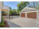 A two-car garage and driveway lead to the backyard and pool area, enhancing curb appeal at 422 Palm St, Mount Pleasant, SC 29464