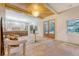 Foyer with wood floors, double glass doors and an open view to a modern kitchen at 422 Palm St, Mount Pleasant, SC 29464