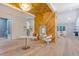Open foyer with hardwood floors, wood accent wall, and elegant chandelier at 422 Palm St, Mount Pleasant, SC 29464