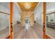 Grand foyer features wood floors, an accent wall, and a modern chandelier at 422 Palm St, Mount Pleasant, SC 29464