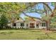 Beautifully landscaped front yard and exterior of home with unique architectural style at 422 Palm St, Mount Pleasant, SC 29464