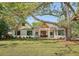 Beautiful craftsman home featuring a landscaped front yard, white siding, and a welcoming entryway at 422 Palm St, Mount Pleasant, SC 29464