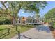 Beautifully landscaped front yard and exterior of home with unique architectural style at 422 Palm St, Mount Pleasant, SC 29464