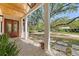Charming front porch with brick flooring, decorative columns, and lush landscaping creates a welcoming entry at 422 Palm St, Mount Pleasant, SC 29464