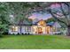 Charming single-story home with large front yard, wooden accents and inviting front porch at 422 Palm St, Mount Pleasant, SC 29464