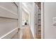 Hallway showcasing hardwood floors leading into a bedroom with vaulted ceilings and a window at 422 Palm St, Mount Pleasant, SC 29464