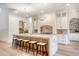 Spacious kitchen featuring a large island with seating, modern lighting fixtures, and hardwood floors throughout at 422 Palm St, Mount Pleasant, SC 29464