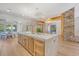 Bright kitchen showcases a large island, modern pendant lights, and a dining area in the background at 422 Palm St, Mount Pleasant, SC 29464