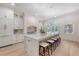 Bright kitchen features a large island with marble countertop and wooden base, as well as pendant lighting and hardwood floors at 422 Palm St, Mount Pleasant, SC 29464