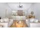 Bright living room with vaulted ceiling, modern fan, and hardwood floors at 422 Palm St, Mount Pleasant, SC 29464