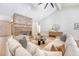 Cozy living room with large sofa, brick fireplace, and hardwood floors at 422 Palm St, Mount Pleasant, SC 29464