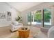 Bright living room with sliding doors, modern furniture, hardwood floors, and decor at 422 Palm St, Mount Pleasant, SC 29464