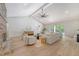 Expansive living room featuring a vaulted ceiling, brick fireplace, and access to the backyard at 422 Palm St, Mount Pleasant, SC 29464
