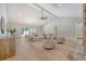 Open-concept living room featuring hardwood floors, high ceilings, and sliding doors to the backyard at 422 Palm St, Mount Pleasant, SC 29464