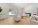 Open-concept living room featuring hardwood floors, high ceilings, and sliding doors to the backyard at 422 Palm St, Mount Pleasant, SC 29464