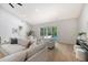 Bright living room with vaulted ceilings, plush seating, and sliding doors to the pool area at 422 Palm St, Mount Pleasant, SC 29464