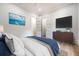 Comfortable main bedroom features hardwood floors, a flatscreen, and modern decor at 422 Palm St, Mount Pleasant, SC 29464
