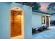 An inviting outdoor shower with wood paneling and an arched entrance adds spa-like luxury at 422 Palm St, Mount Pleasant, SC 29464