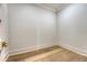 Empty room featuring hardwood floors, white trim, and a corner view at 422 Palm St, Mount Pleasant, SC 29464