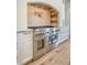 Close-up showcases a stainless steel Thermador stove with a pot filler and hood, complemented by marble countertops at 422 Palm St, Mount Pleasant, SC 29464
