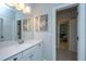 Clean, bright bathroom featuring a modern vanity, quartz countertops, and tiled flooring at 474 Woodspring Rd, Mount Pleasant, SC 29466